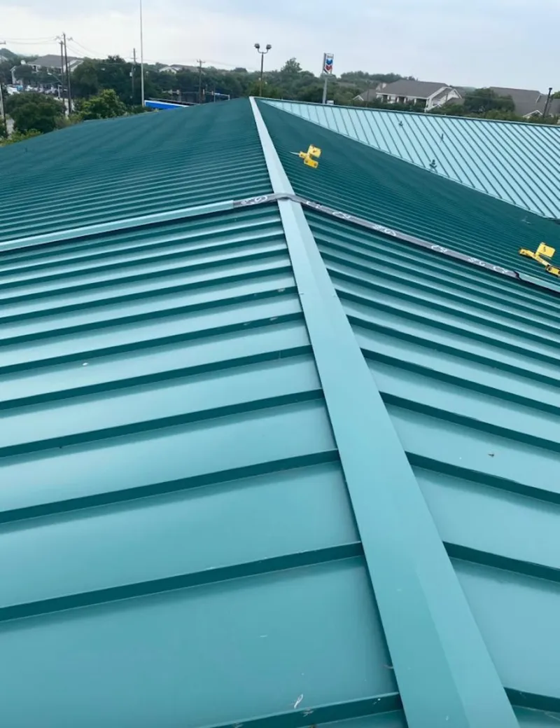 Green commercial metal roof ridge and valley for Metal Roof Repair in Dakota Ridge